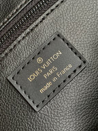 Louis Vuitton leather patch label reading “Louis Vuitton Paris” and “made in France”