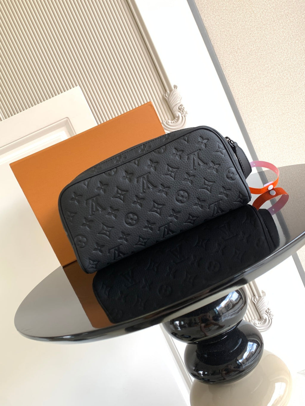 Louis Vuitton bag set with dark monogram texture, top zippers, and hanging tags