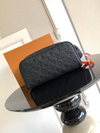 Louis Vuitton bag set with dark monogram texture, top zippers, and hanging tags