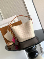 Louis Vuitton shoulder bag with tan monogram canvas, leather handles and trim