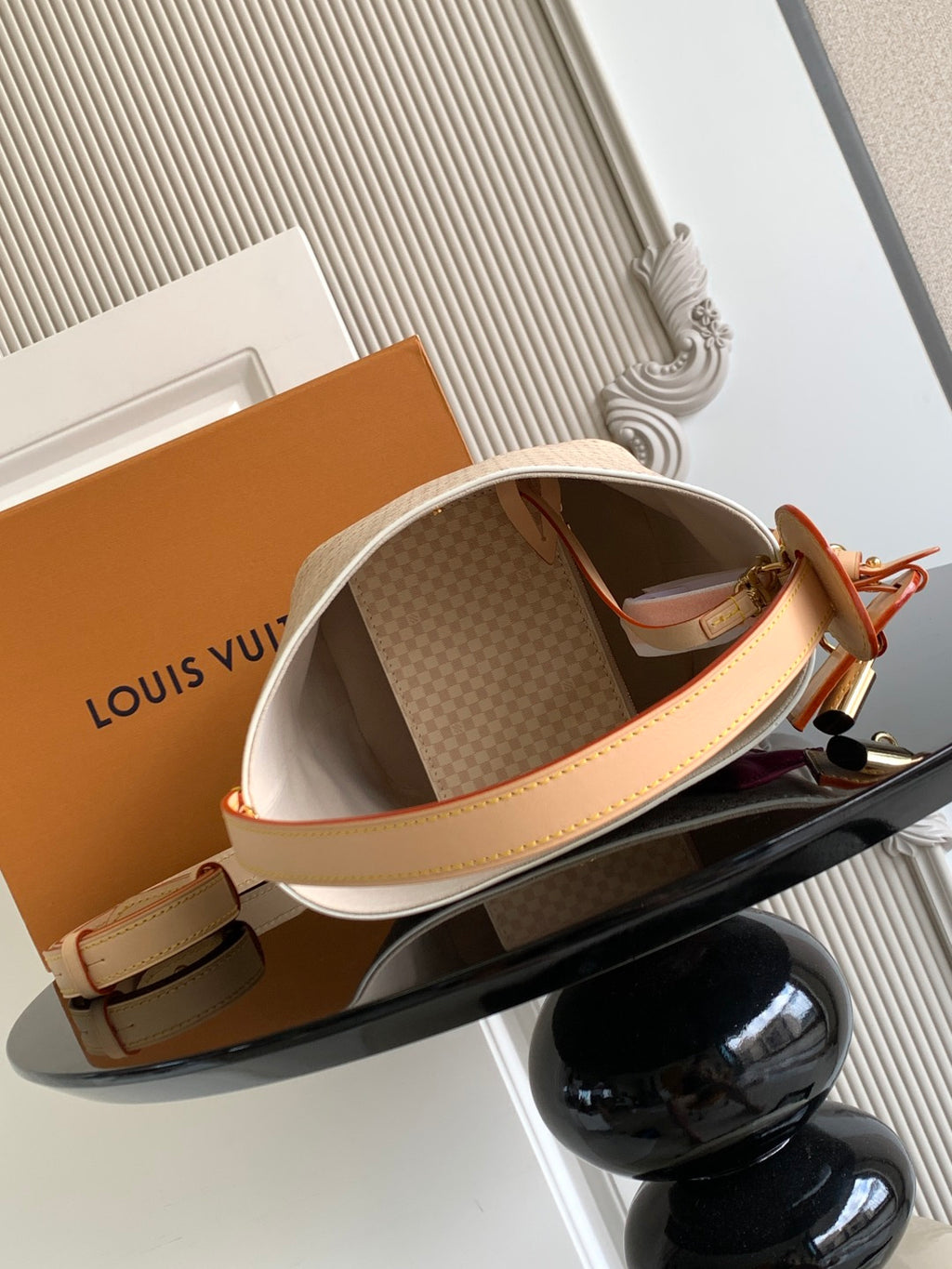 Louis Vuitton small shoulder bag with open top, beige interior and tan leather strap