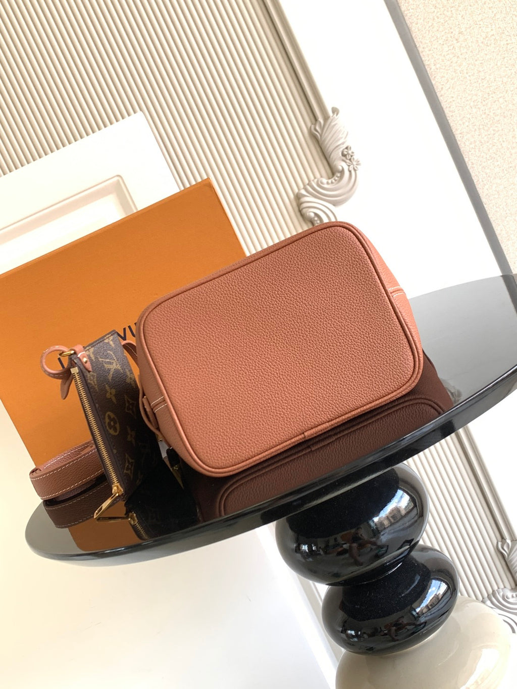 Louis Vuitton crossbody flap bag in pink leather with front pocket and adjustable strap