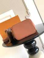 Louis Vuitton crossbody flap bag in pink leather with front pocket and adjustable strap