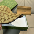 Gucci cap profile with brown GG canvas and dark fabric brim trim