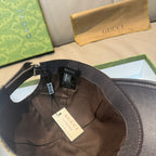 Gucci cap interior with black mesh lining and adjustable strap with tags