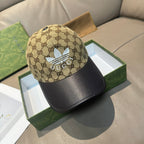Gucci cap in beige GG canvas with black leather brim and blue flower applique