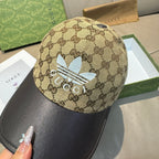 Gucci cap in beige GG canvas with blue flower and “GUCCI” front detailing