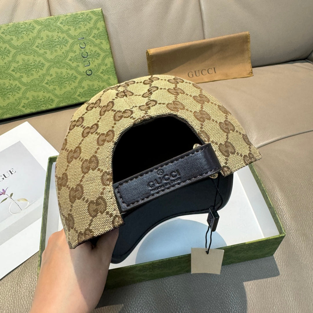 Gucci cap with beige GG canvas side panel and black leather strap closure
