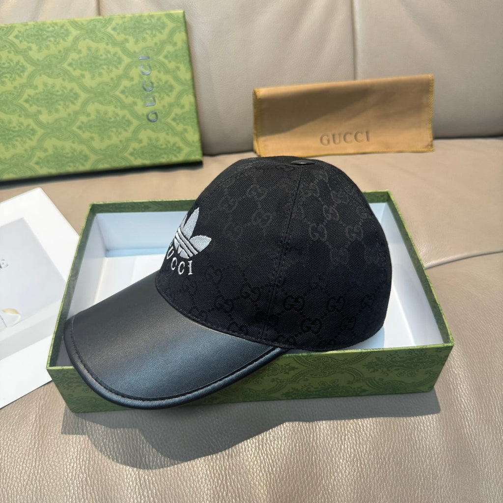 Black Gucci cap with side GG monogram print and white logo, curved black brim