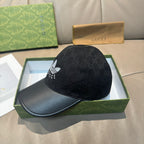 Black Gucci cap with side GG monogram print and white logo, curved black brim