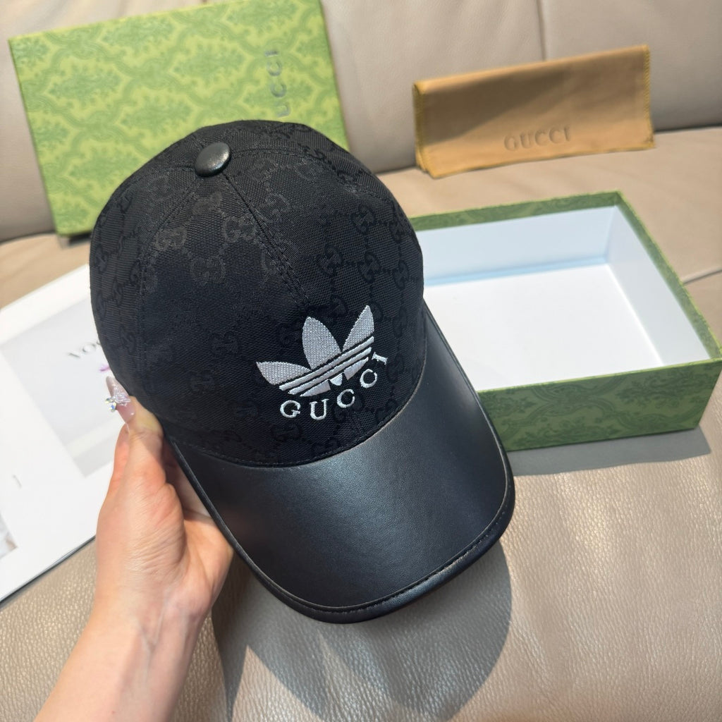 Black Gucci cap with GG monogram crown, white logo front and small top button
