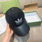 Black Gucci cap with GG monogram crown, white logo front and small top button