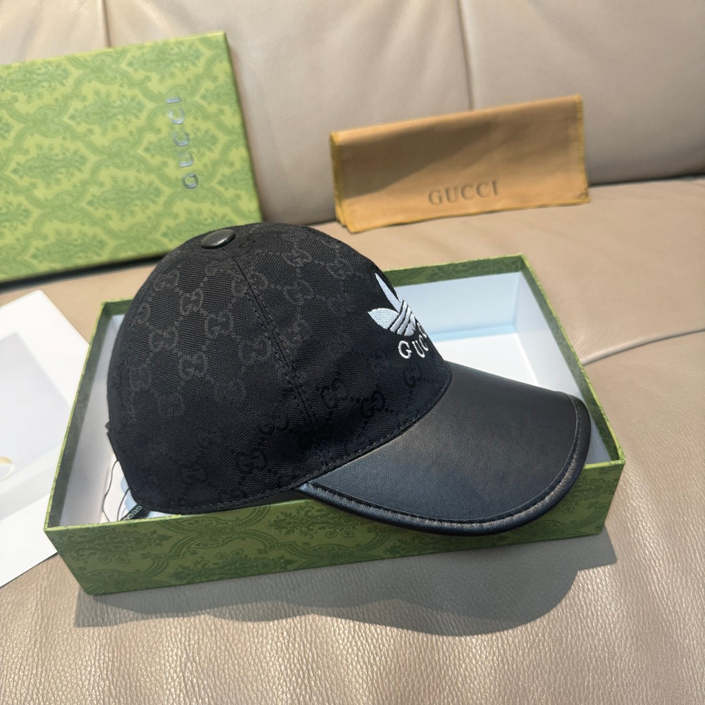 Black Gucci cap with GG monogram crown and white logo patch, curved brim