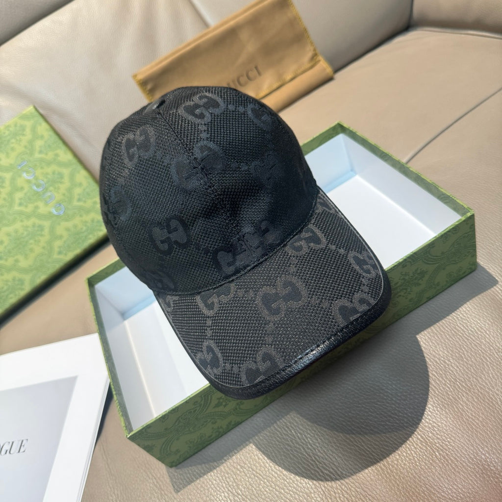 Black GG-pattern baseball cap with curved brim and adjustable strap.