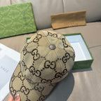 Beige Gucci cap with GG monogram pattern and top button