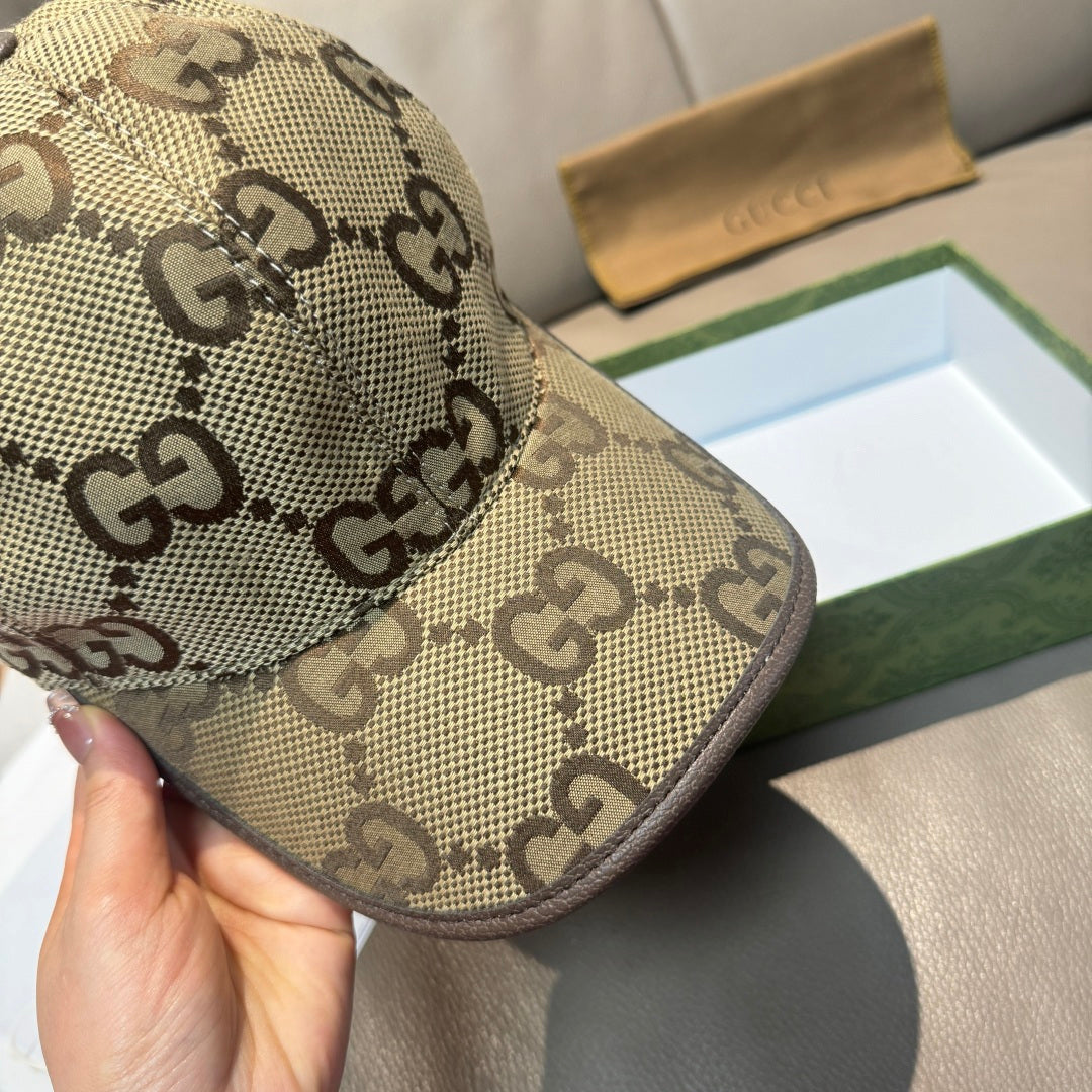 Beige Gucci cap with GG monogram pattern, curved brim close-up