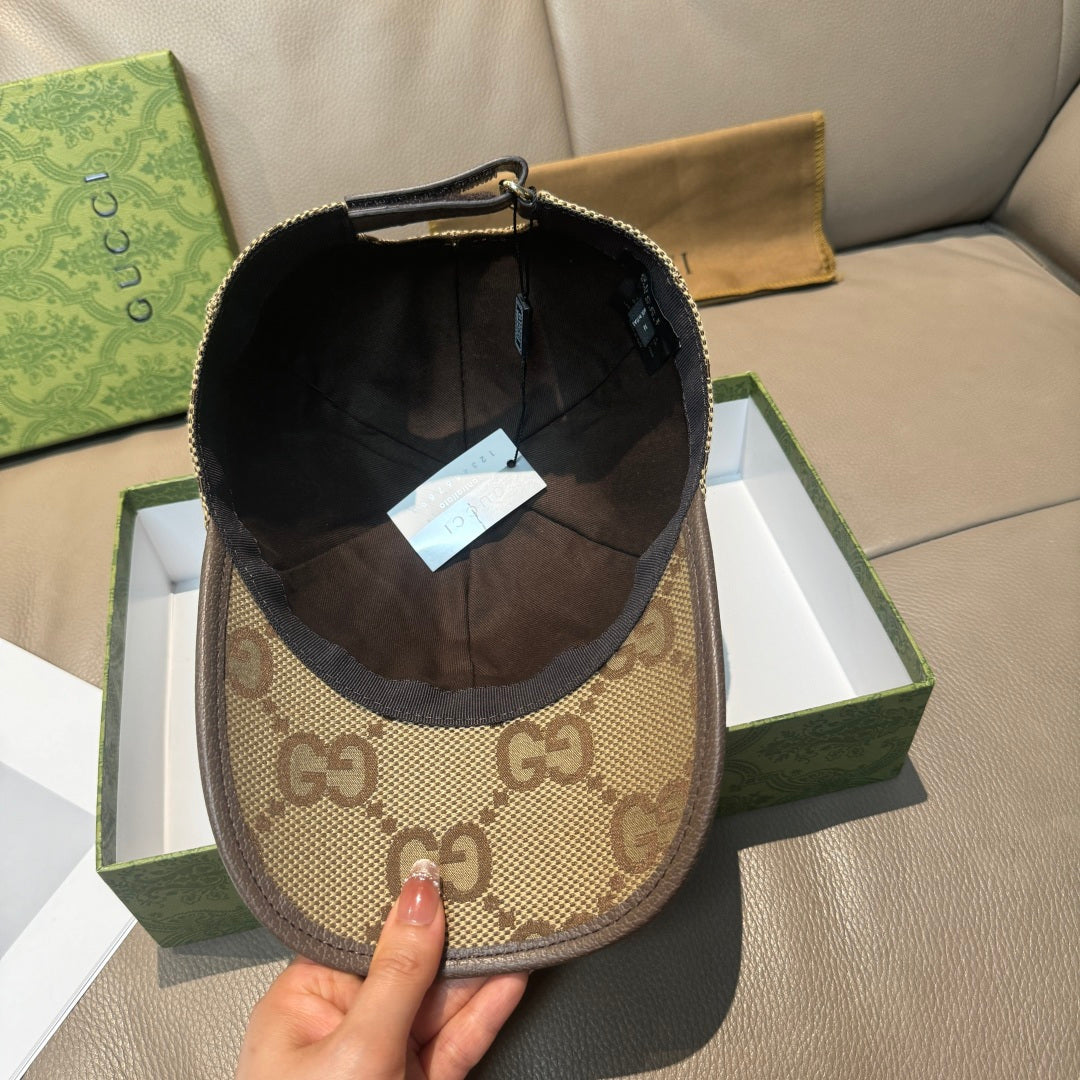 Beige Gucci cap with GG monogram exterior and black interior