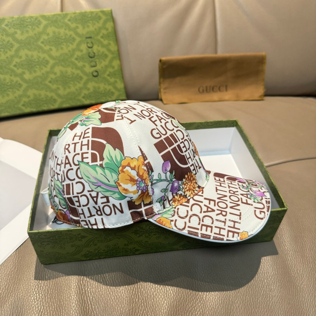 Gucci cap with white back panel and multicolor floral and text graphic, curved brim