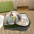 Gucci cap with white back panel and multicolor floral and text graphic, curved brim