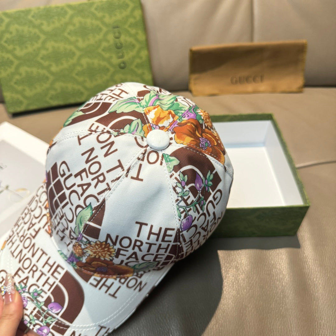 Gucci cap with white side panel and multicolor floral text print, curved brim