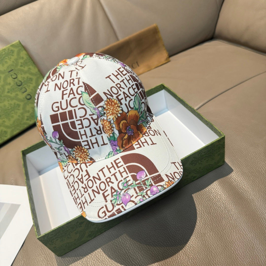 Gucci cap with white base and multicolor North Face logo print, curved brim