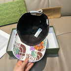 Gucci cap with black interior lining and colorful floral logo print on underside
