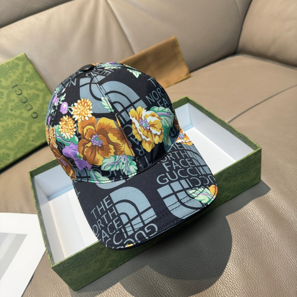 Gucci baseball cap with black logo print and colorful floral panel front