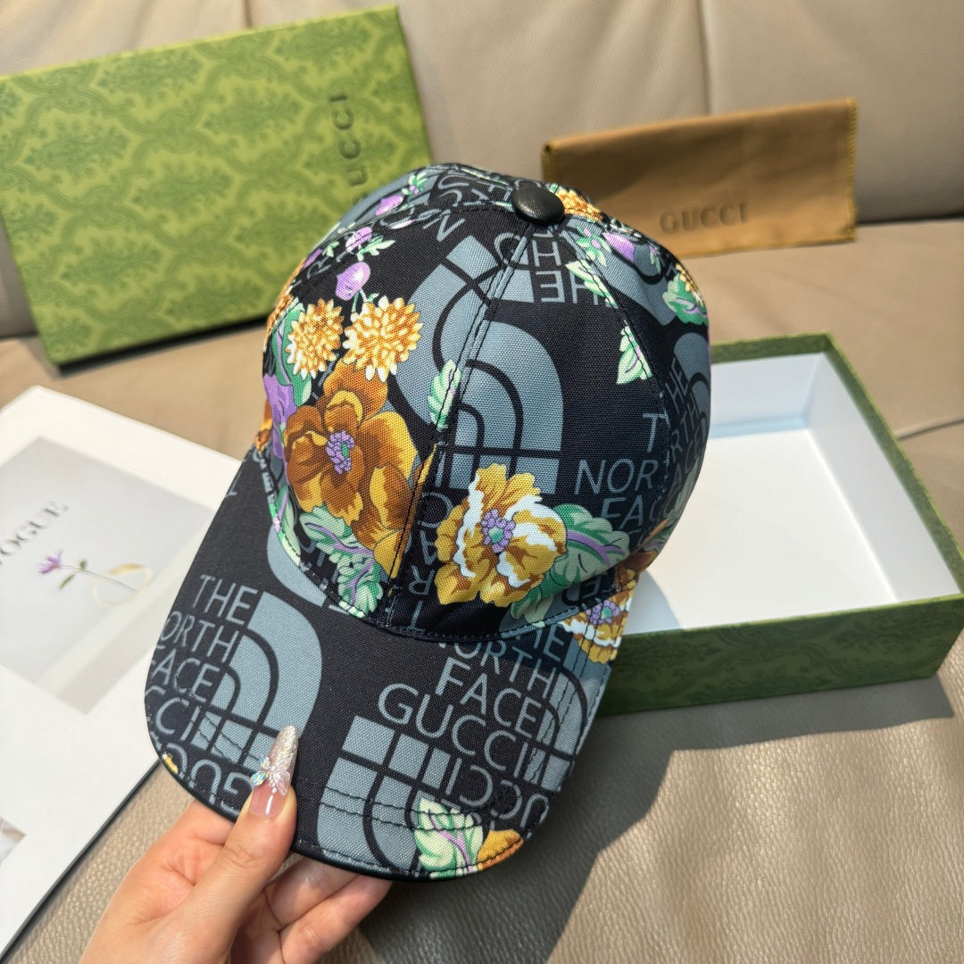 Gucci baseball cap side view, black logo print with bright floral decorations
