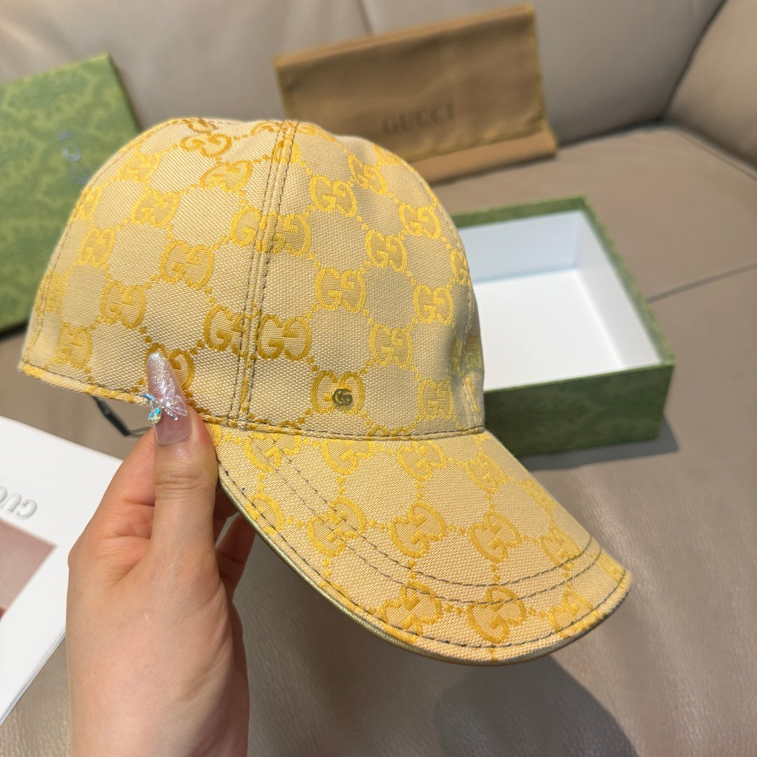 Yellow GG logo baseball cap shown in side view, curved brim