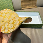 Yellow GG logo baseball cap with curved brim, side profile view