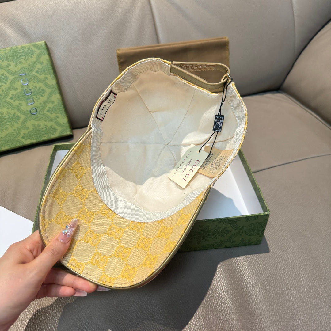 Yellow GG logo baseball cap interior with white lining and size tag