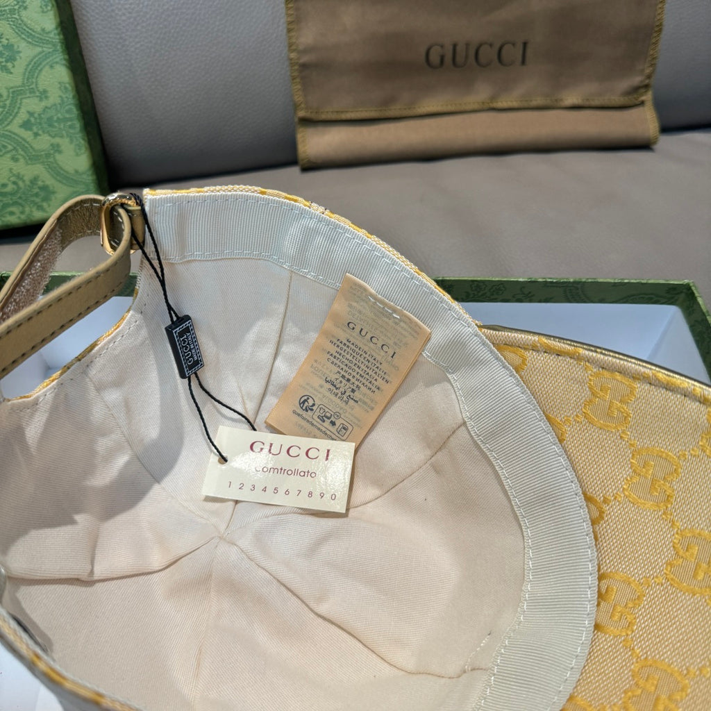 Yellow GG logo baseball cap interior crown with attached swing tag
