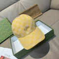Yellow GG logo baseball cap with curved brim and stitched front panel