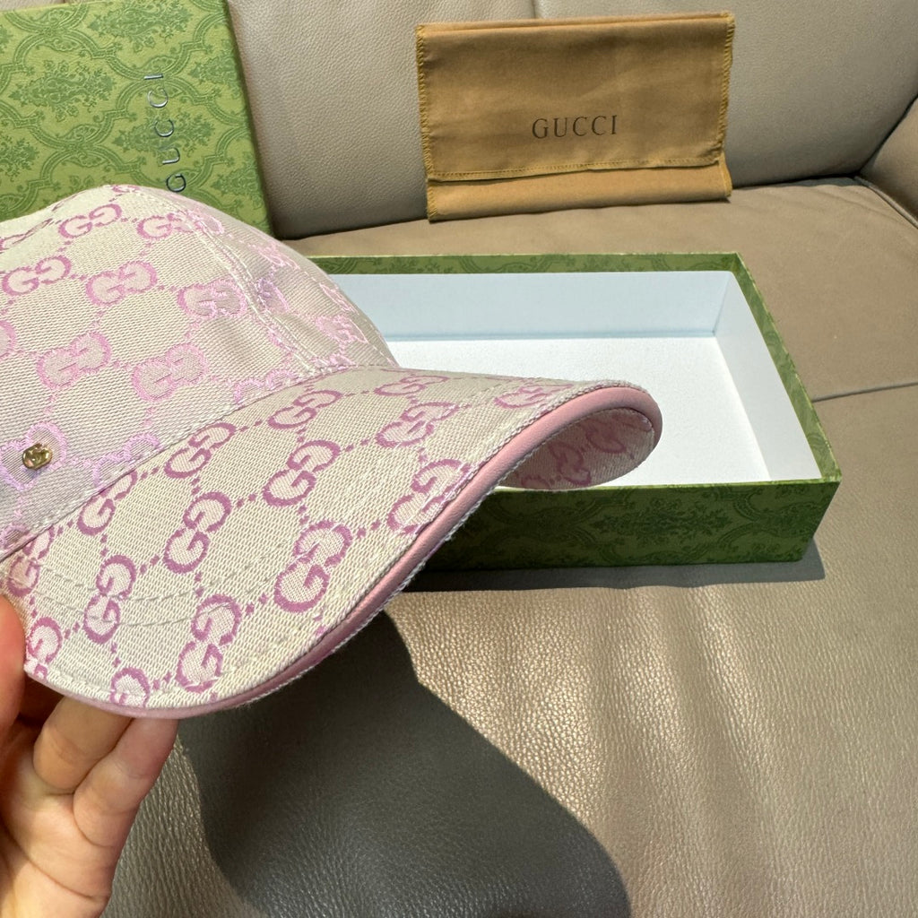 Gucci cap side view in pink and lavender GG monogram with pink trim brim
