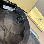 Black cap with fabric strap and swing tag, inside seam visible