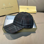 Plaid baseball cap, dark navy with red and gray checks, on an open gift box