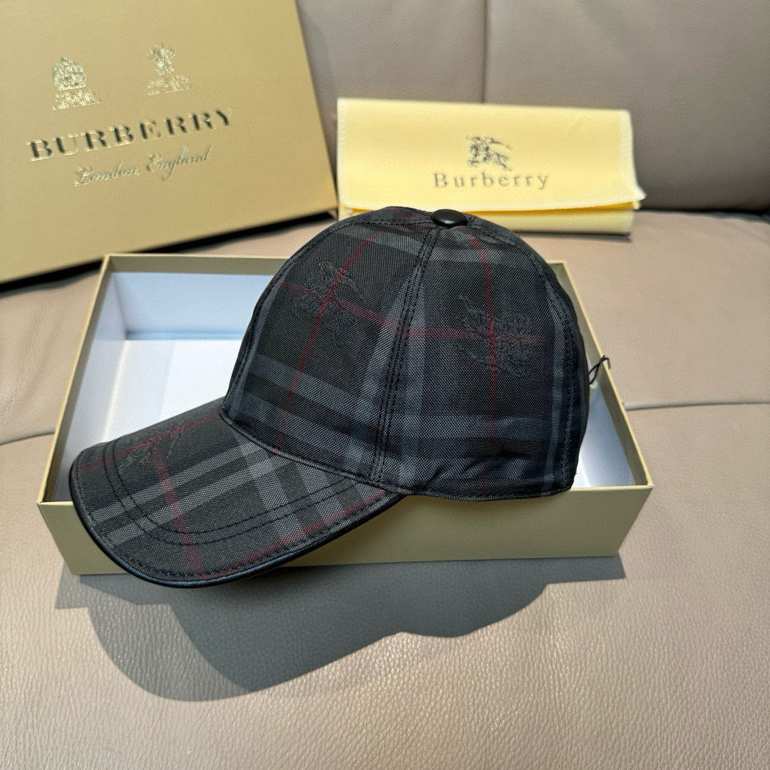 Plaid baseball cap, dark navy with red and gray checks, on an open gift box