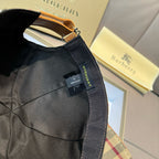 Black baseball cap with adjustable webbing strap and interior label