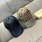 Plaid and dark denim baseball caps, both with fabric crowns and brims