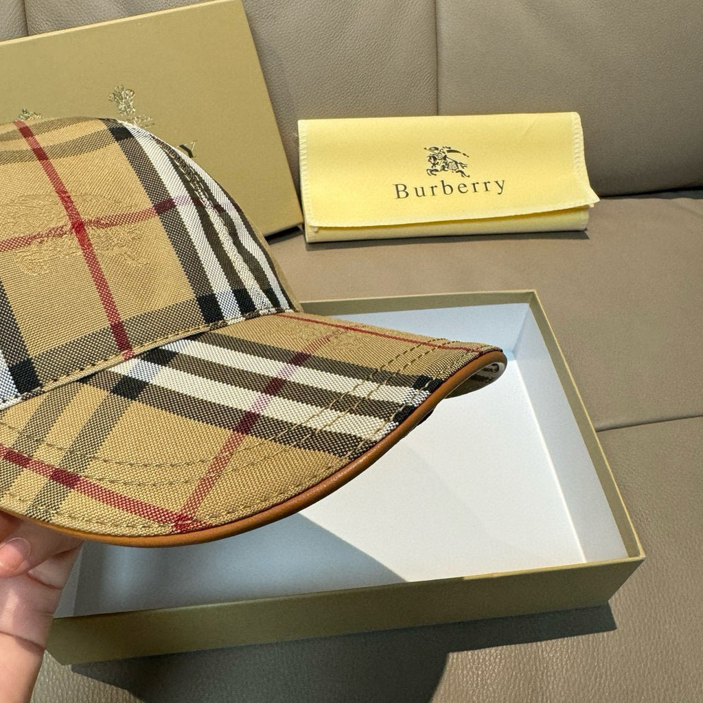 Plaid baseball cap visor close-up with stitching and patterned underside