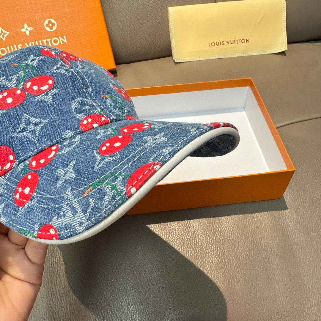 Blue denim cap with red mushroom pattern and light-trimmed underside brim