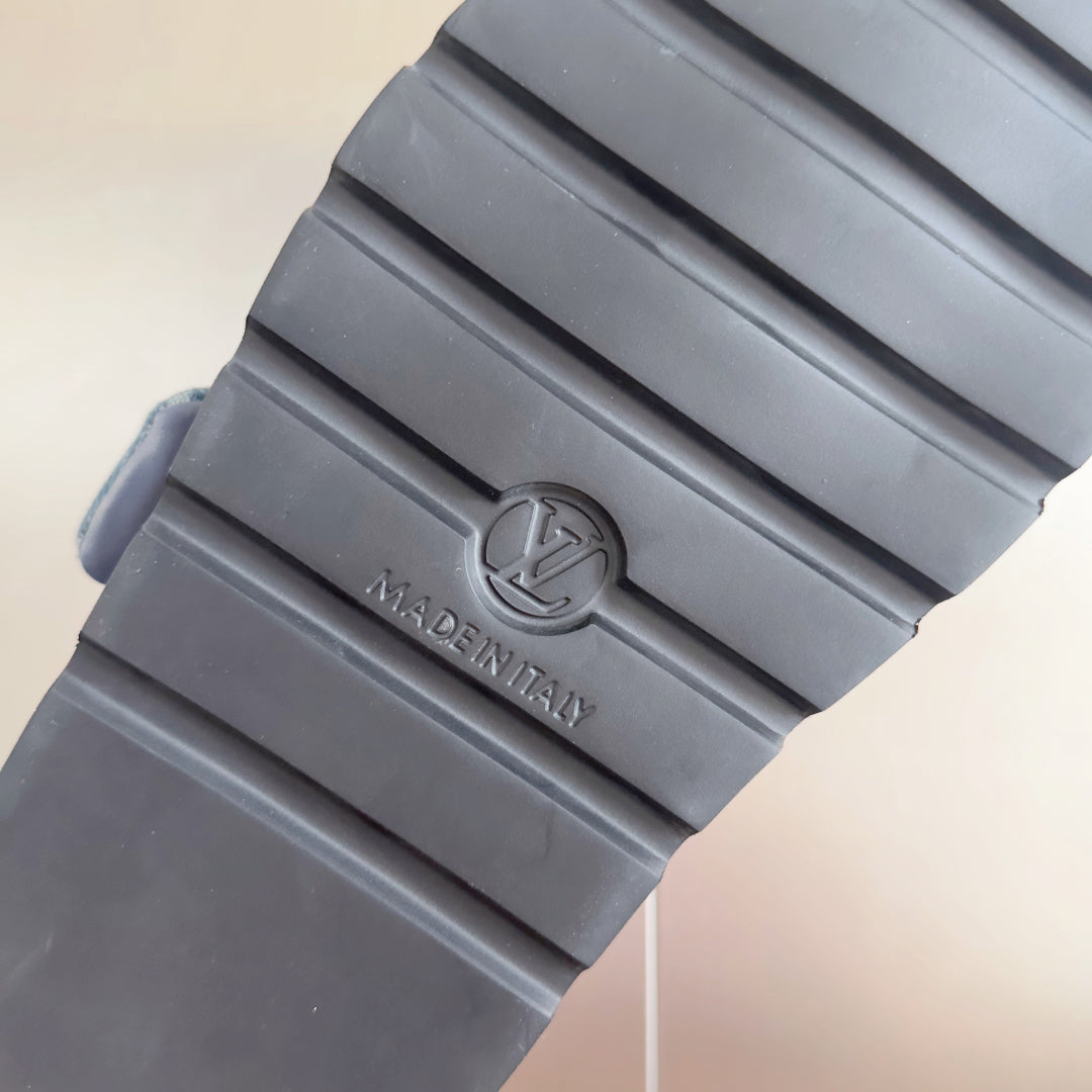 Grey rubber sandal outsole with Louis Vuitton logo and 'MADE IN ITALY' imprint