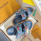 Blue Louis Vuitton slide sandals in box with cherry-pattern fabric straps and tan buckle