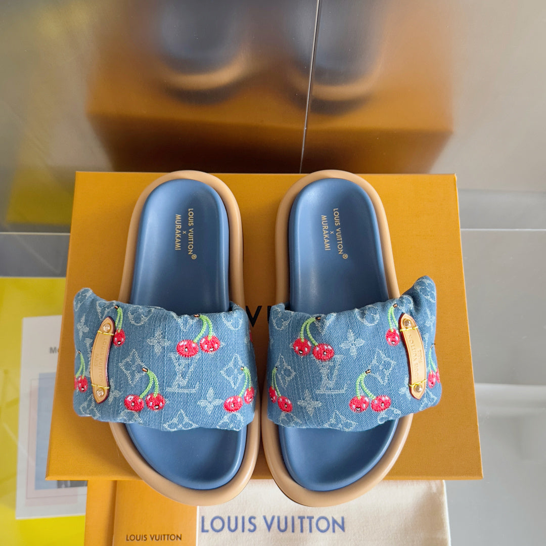 Louis Vuitton denim-blue slide sandals with cherry print uppers and tan-edged footbed