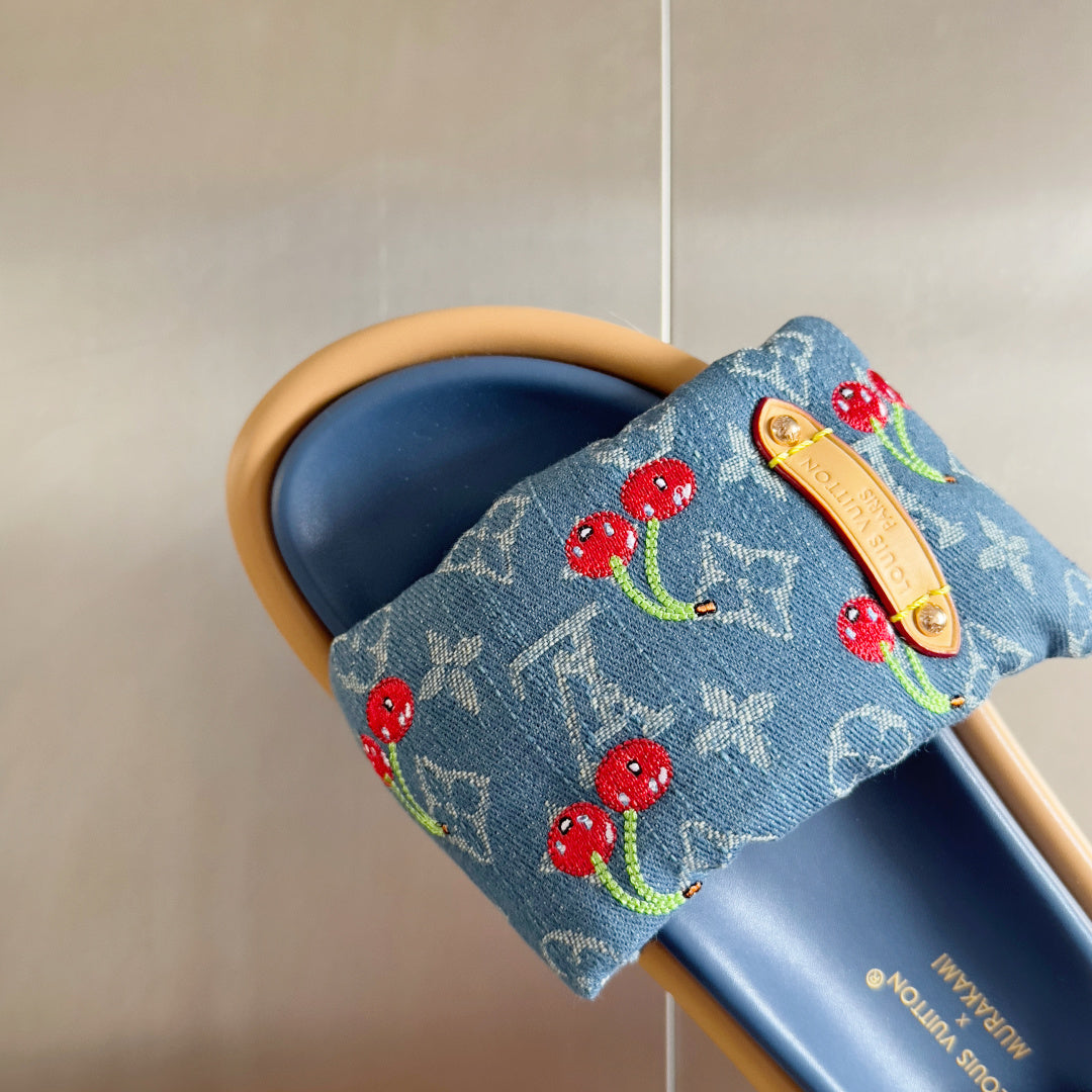 Louis Vuitton denim-blue slide sandal strap with cherry print and tan gold-tone buckle