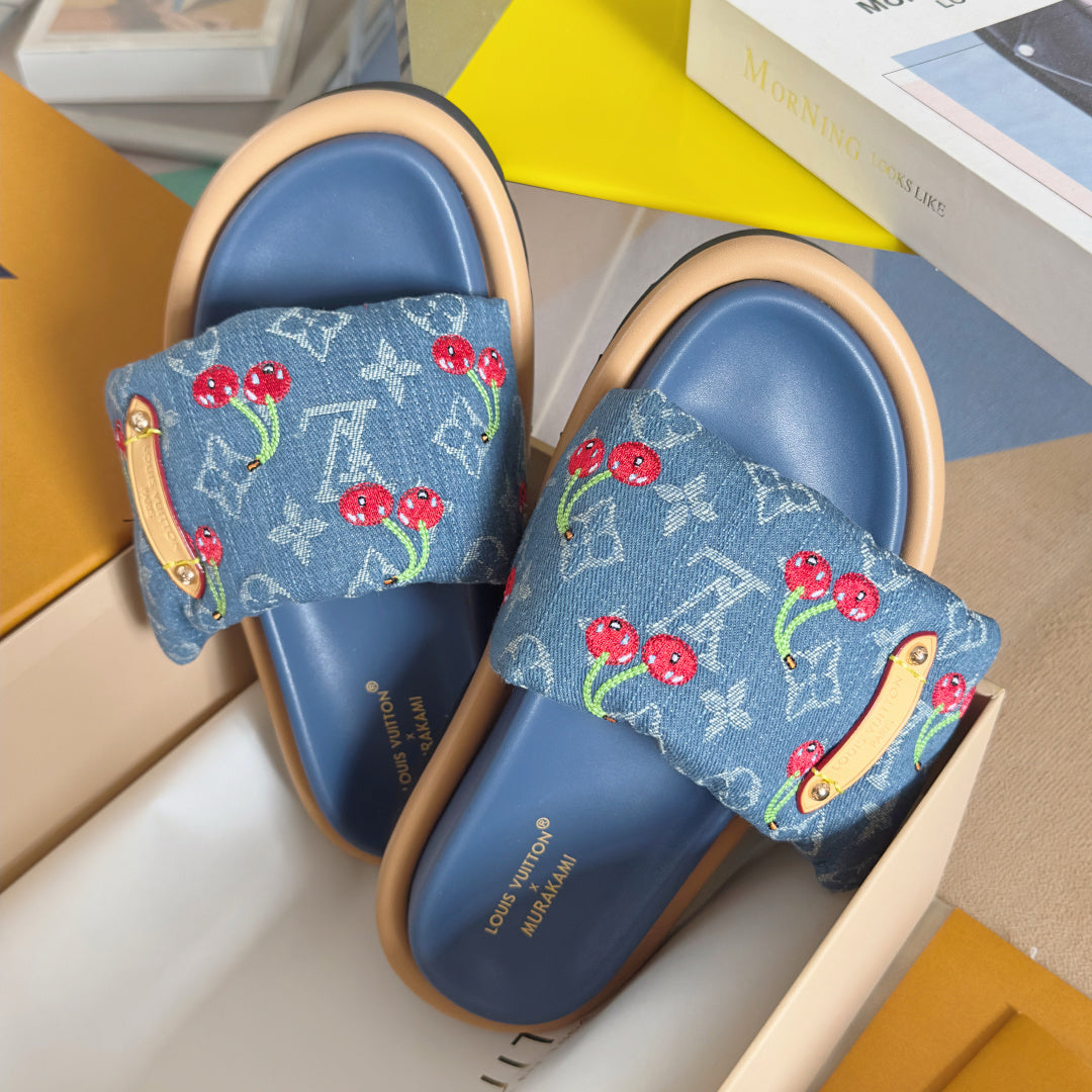 Louis Vuitton denim-blue slide sandals with cherry print straps, gold-tone buckle, wide band