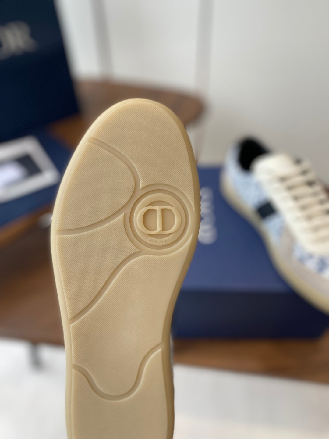 Dior sneaker outsole in light beige with heart and D logo