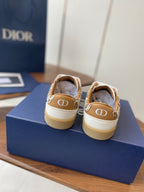 Dior unisex sneakers showing back heel with monogrammed detail and white laces