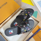 Louis Vuitton slide sandals in black with multicolor monogram flower patterned straps