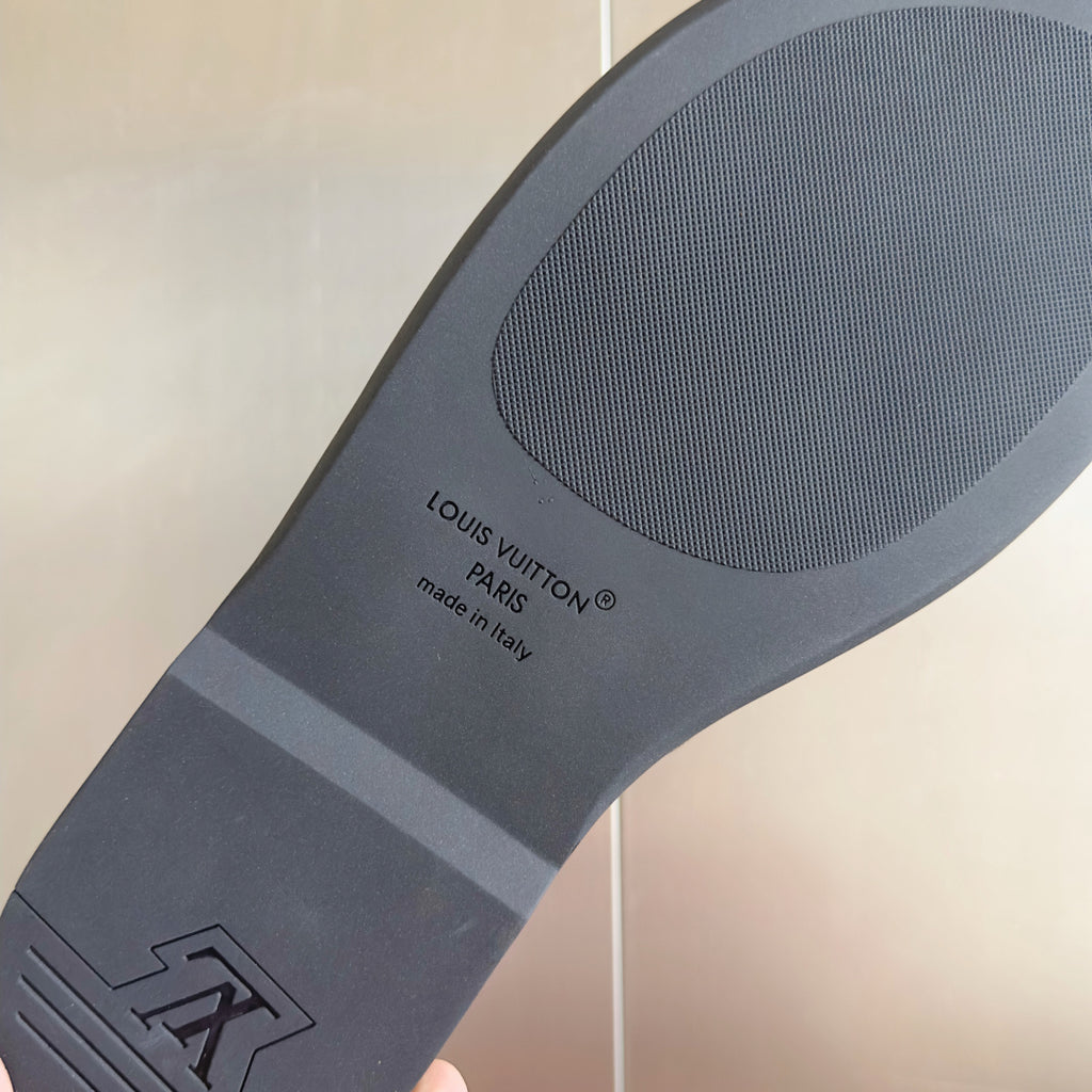 Louis Vuitton slide sandal outsole, gray tread with 'Made in Italy' text